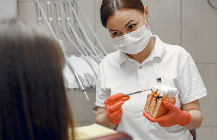 dentist explaining information about tooth to patient